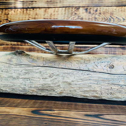 14 inch wood steering wheel Mercedes by Punk Wheels showing wood grain and metal spokes on rustic wooden background