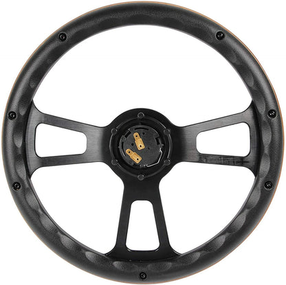 Black steering wheel with gold horn button contacts on a white background