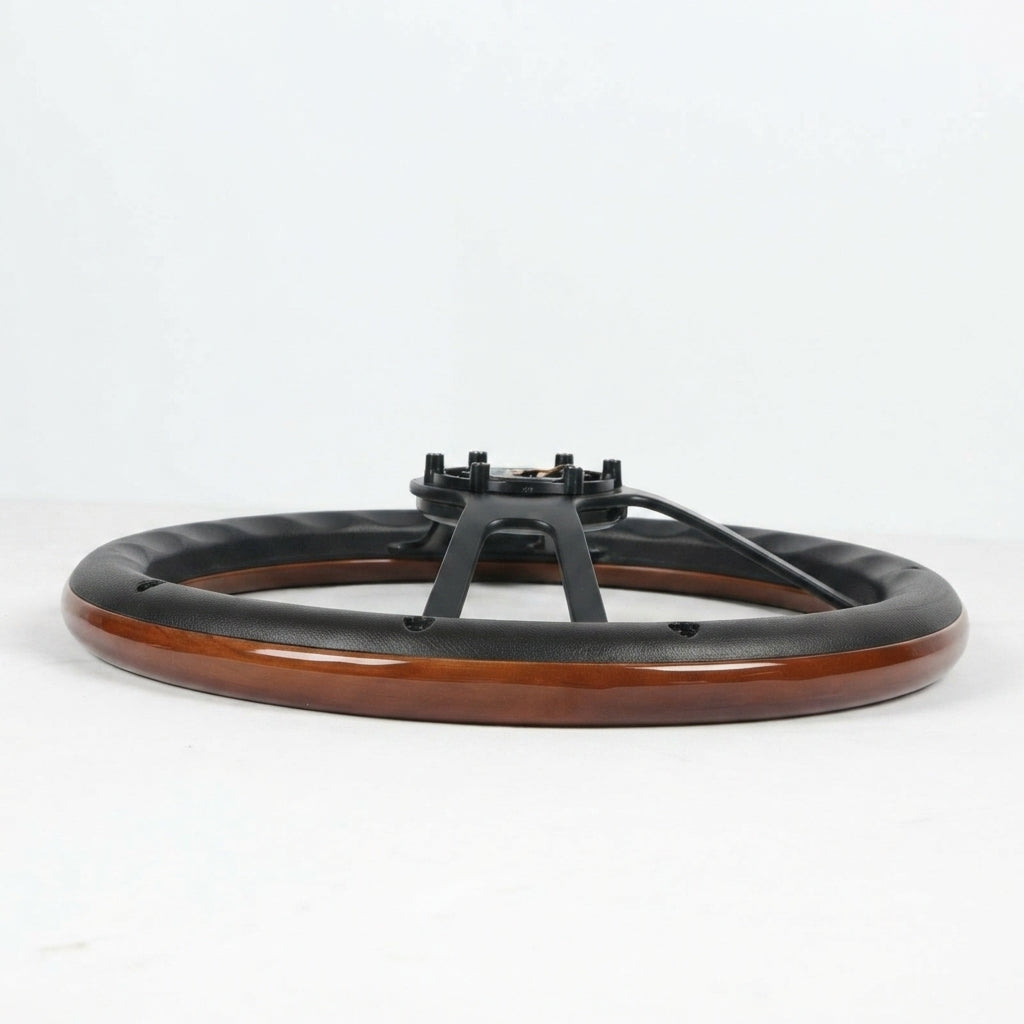 A circular black and wood table base or pedestal with a glossy brown wood-grain outer ring and a black metal central support structure, photographed on a clean white studio background.