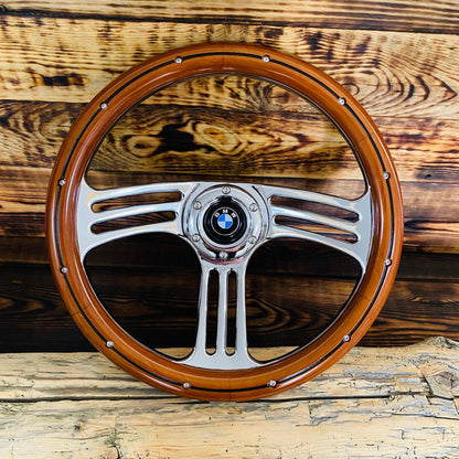 14 inch wood steering wheel with polished metal spokes and BMW logo center for BMW vehicles front view