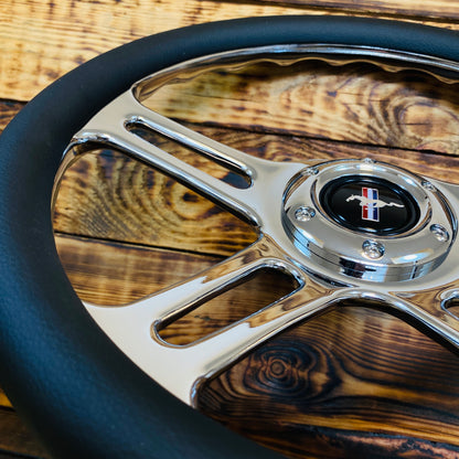 14-inch leather and chrome aftermarket steering wheel for Mustang with Mustang emblem close-up view