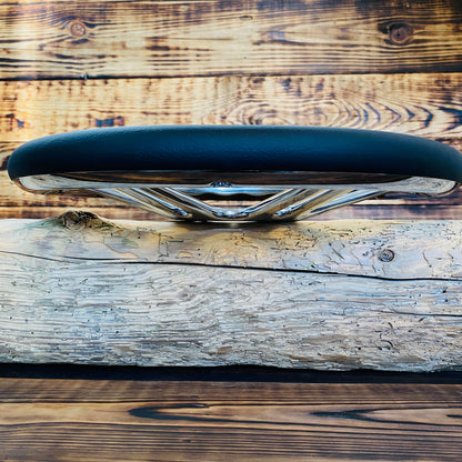 14 inch leather aftermarket steering wheel for Mustang by Punk Wheels shown from side view with chrome spokes