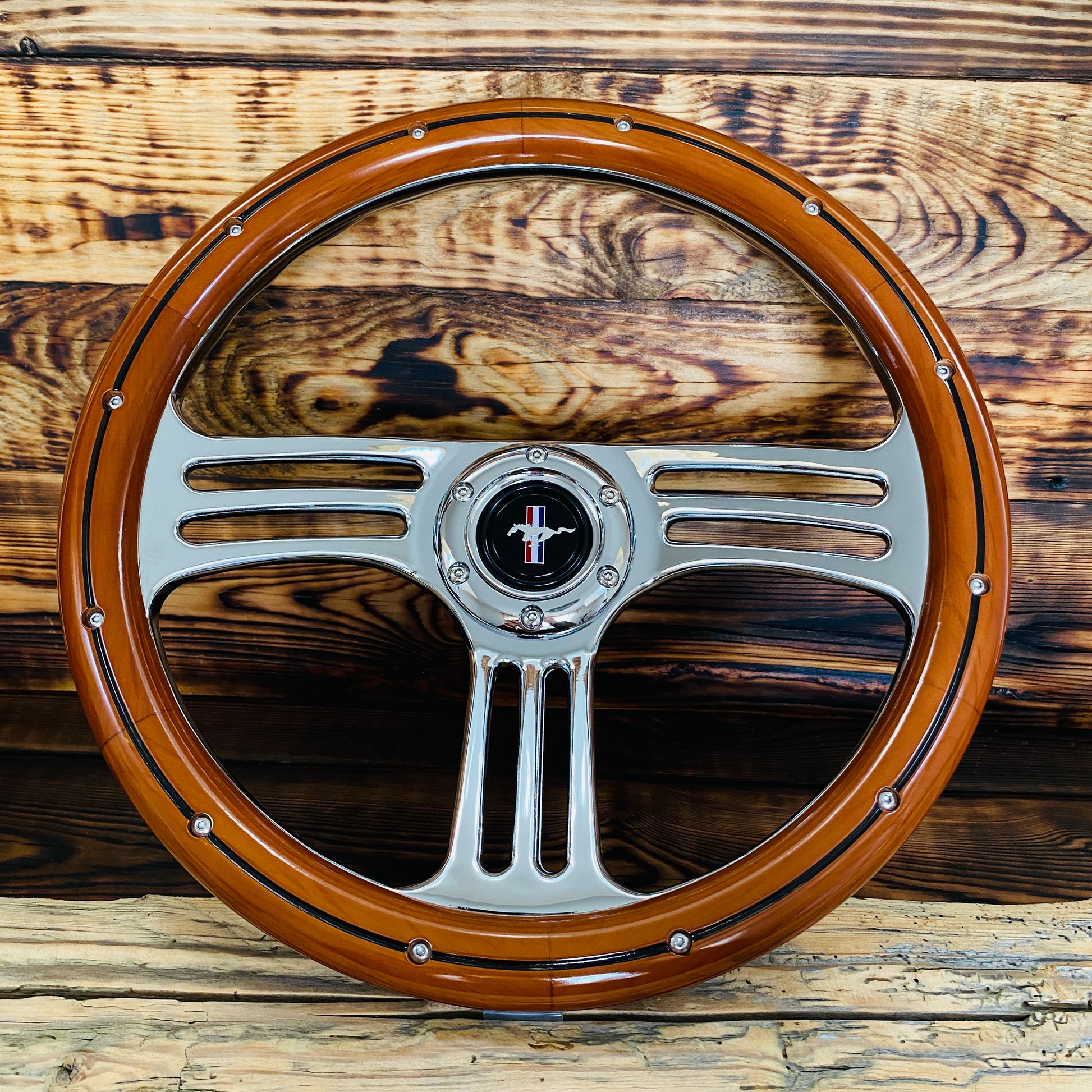 14in Mustang wood steering wheel with polished metal spokes and center emblem front view by Punk Wheels