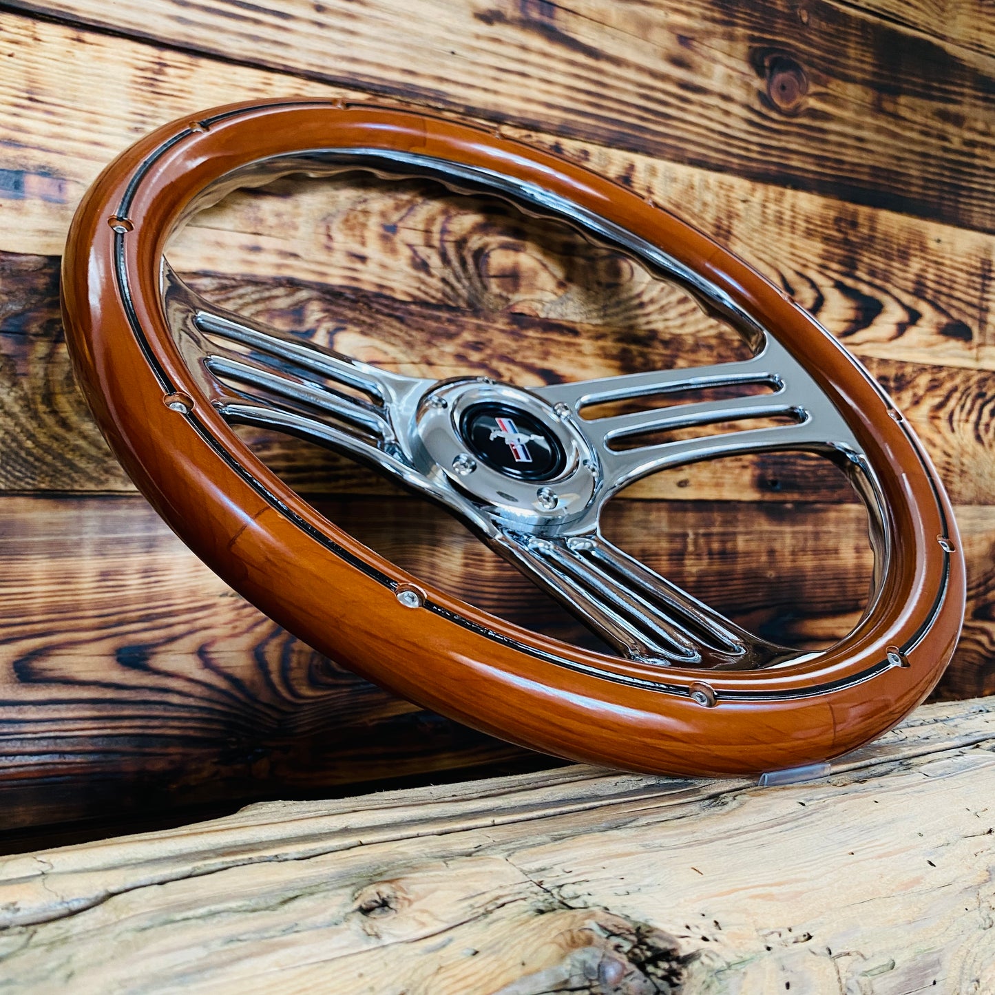 14 inch Mustang wood steering wheel with polished metal spokes and pony emblem center view