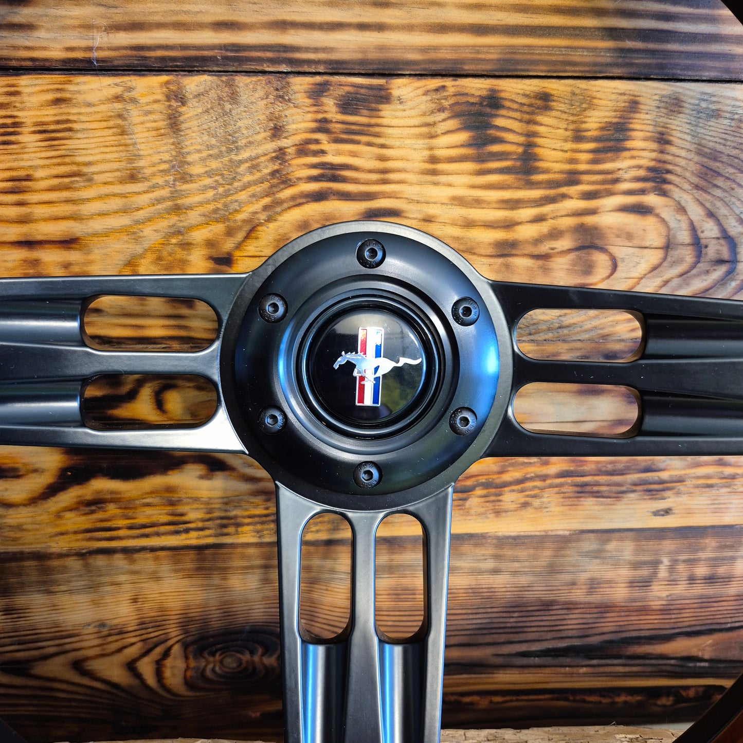 14 inch metal and wood steering wheel for Ford Mustang with Mustang emblem center close-up