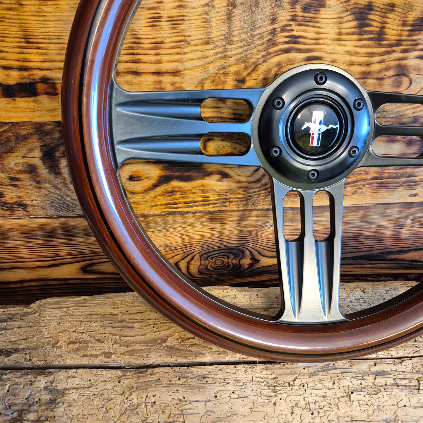 14in wood steering wheel for Ford Mustang with metal spokes and Mustang emblem front view