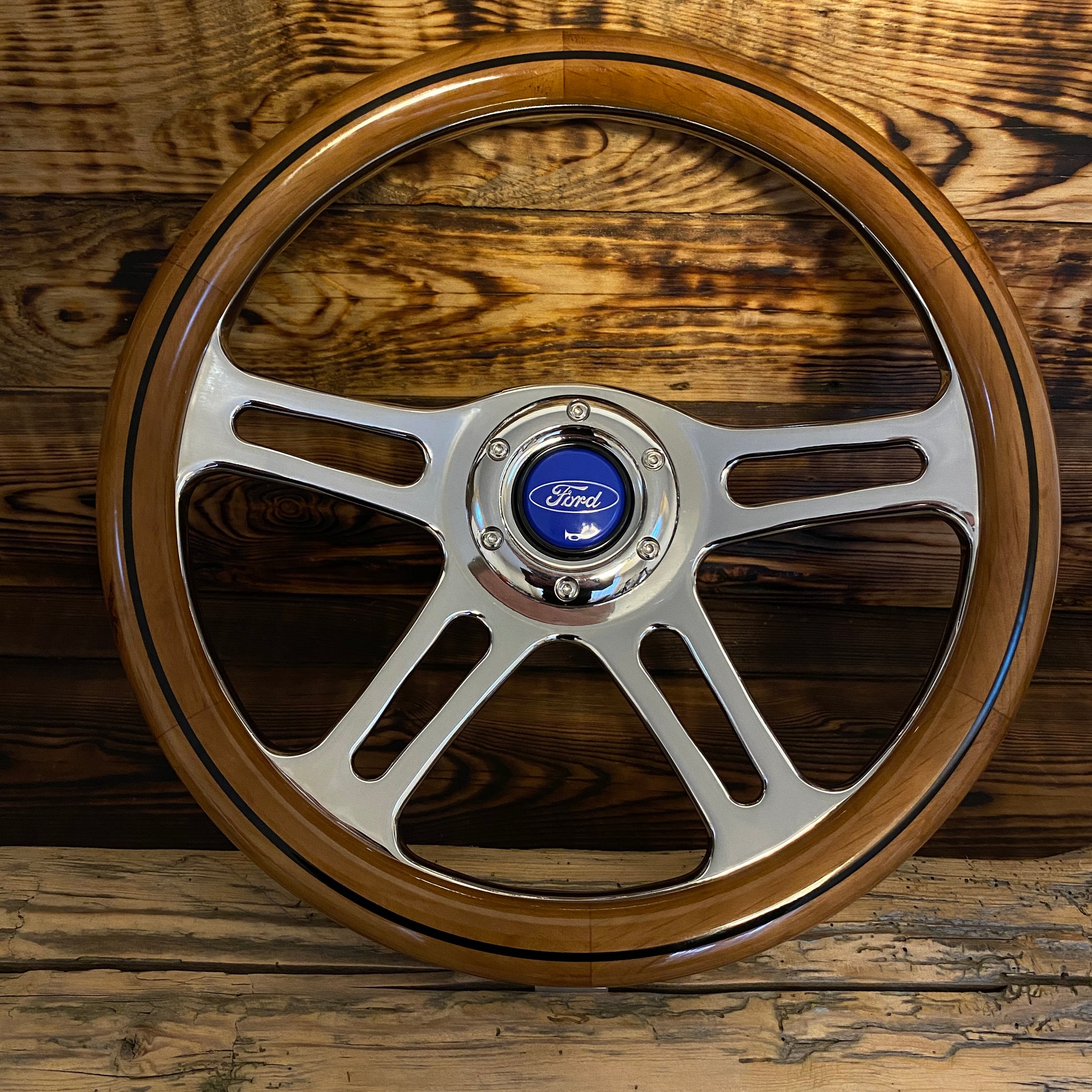 14in wood steering wheel for Ford with polished metal spokes and blue Ford center emblem front view