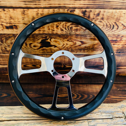 14 inch Ford wooden steering wheel with black leather rim and polished metal spokes front view