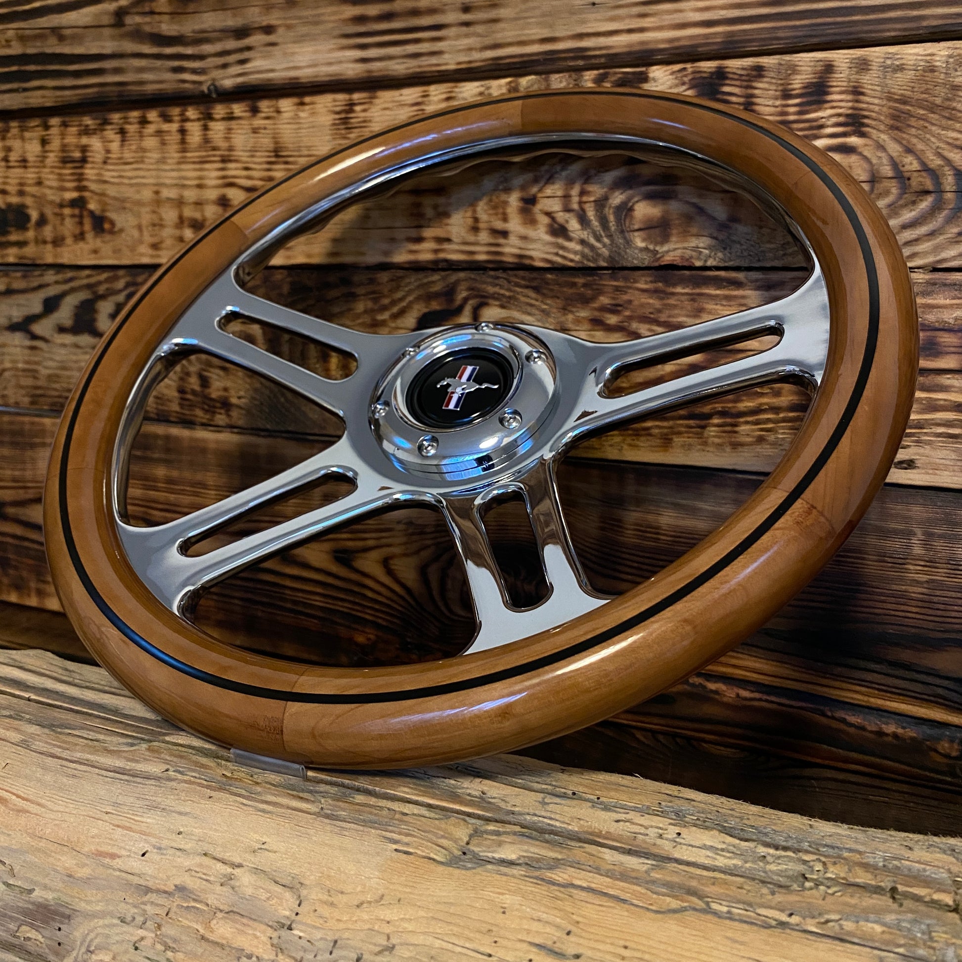 14 inch wooden steering wheel for Mustang with polished metal spokes and classic Mustang emblem front view