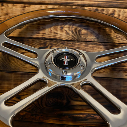 14 inch wooden steering wheel for Mustang with polished metal spokes and pony emblem center viewed from front