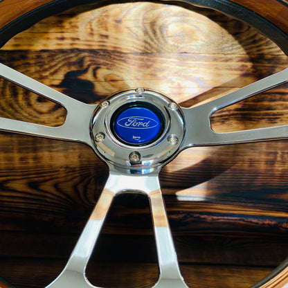 14 inch Ford wooden steering wheel by Punk Wheels with polished metal spokes and classic Ford horn button close-up
