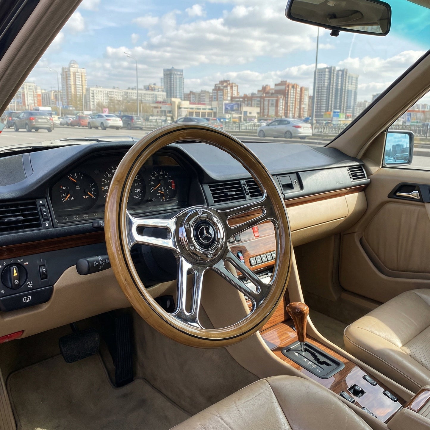 14 inch wood steering wheel for Mercedes with chrome spokes installed inside classic car interior