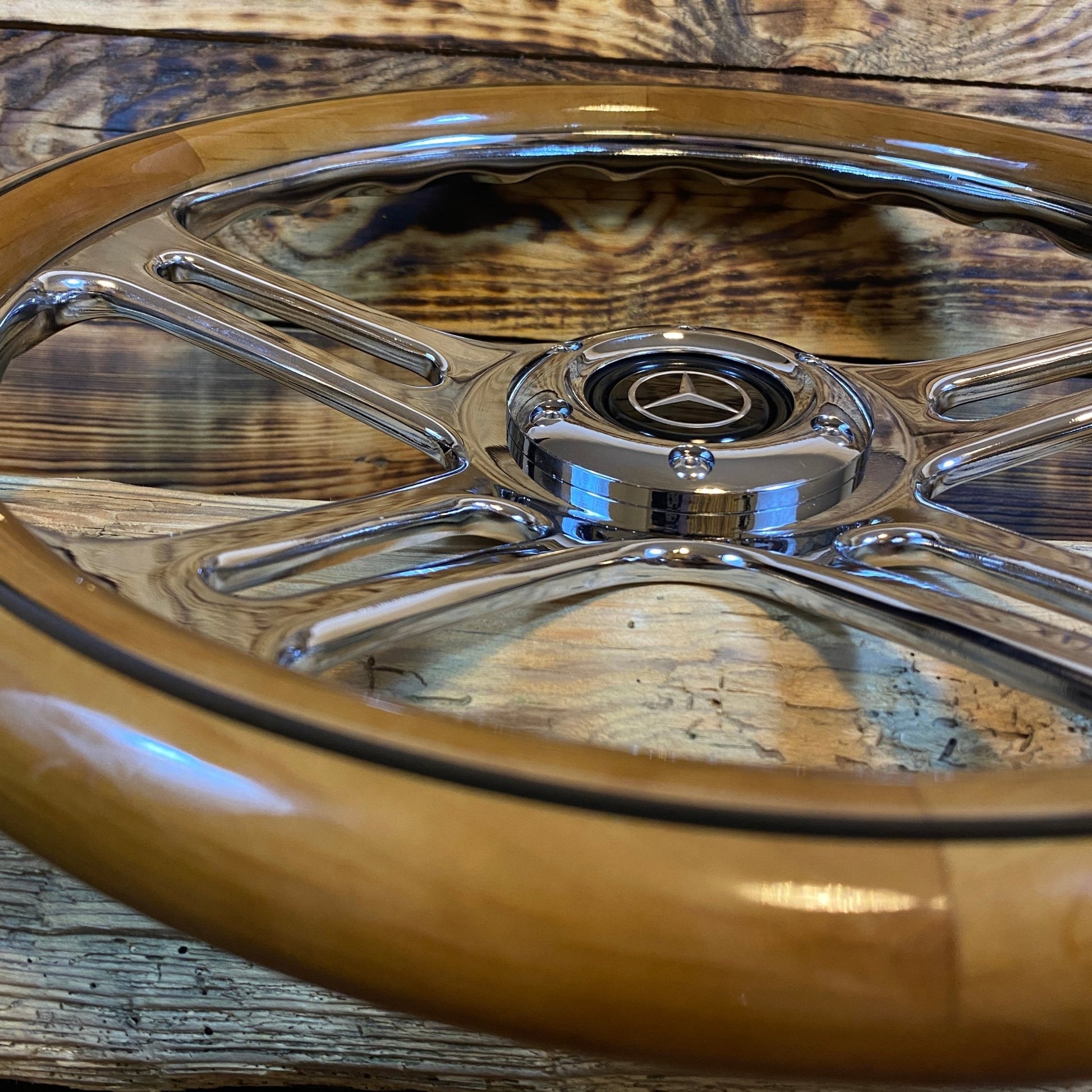 14-inch wood steering wheel for Mercedes with chrome spokes and center emblem close-up view