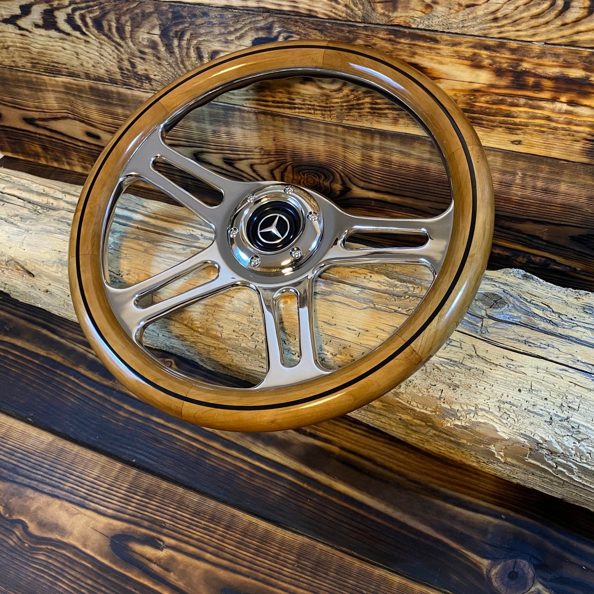 14 inch wood steering wheel with metal spokes and Mercedes emblem center for Mercedes view angled