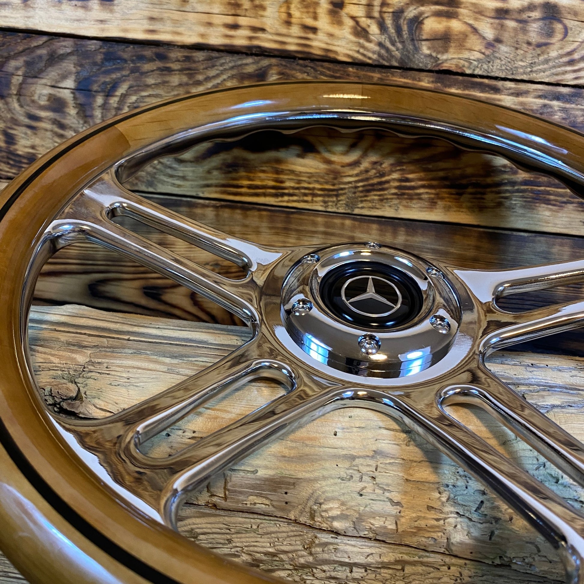 14 inch wood steering wheel for Mercedes with polished metal spokes and Mercedes logo center view
