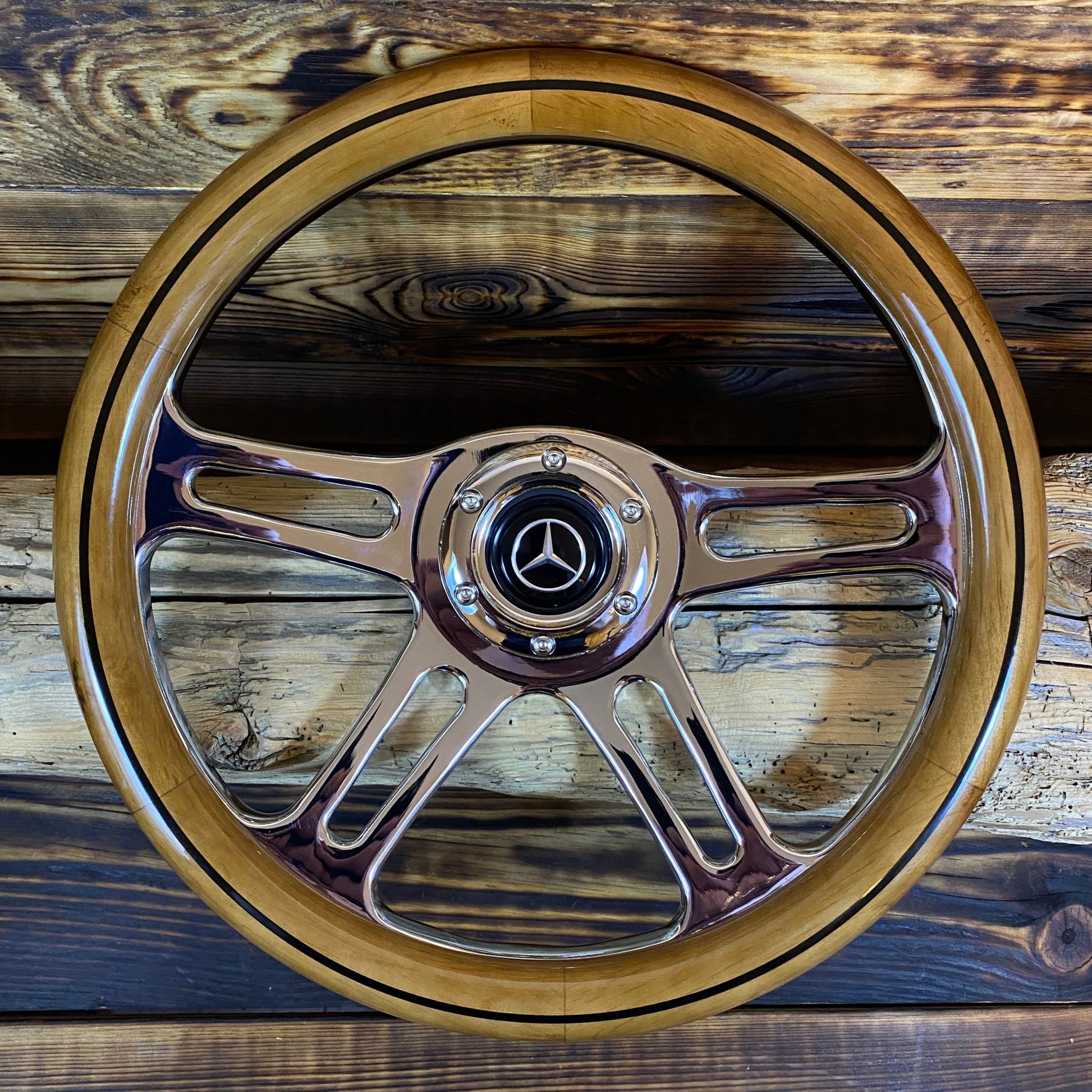 14in wood steering wheel for Mercedes with polished metal spokes and center emblem front view