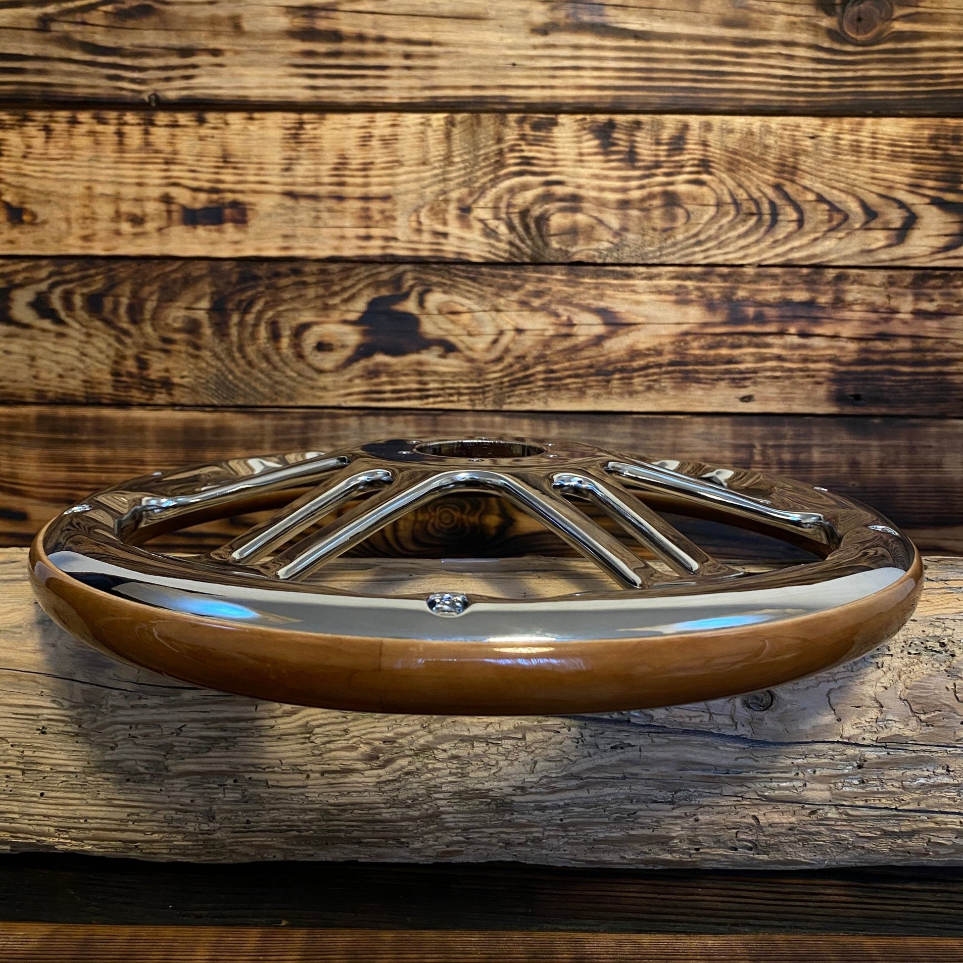 14 inch wood and chrome steering wheel for Mercedes by Punk Wheels front view on wooden background