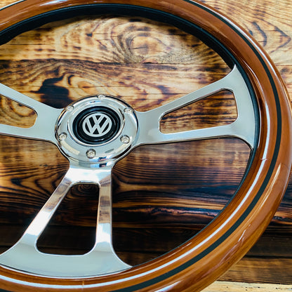 14 inch wood steering wheel for VW with polished metal spokes and VW logo center close-up view